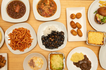 Set of Mediterranean food dishes with pasta with chorizo, white bean stew, meat lasagna, beef...