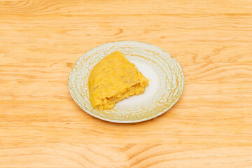 Portion of Betanzos omelette with juicy egg to serve with a lid in a restaurant