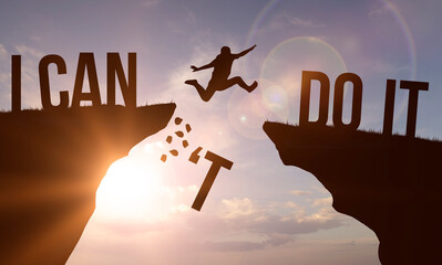 I can't do it and I can do it concept. Man jumping over cliff on sunset background. Business...