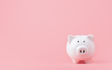 Money saving and investment concept. Piggy bank on pink background with copy space