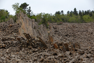 The nature of the Far East. High stone outliers stand on a rocky slope. The foot of Mount Lysaya in the Primorsky region.