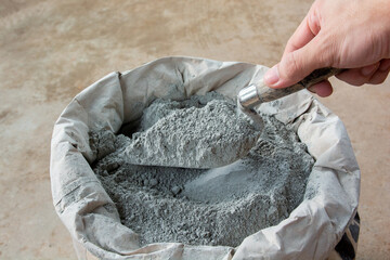 Cement powder with trowel put in bag package.