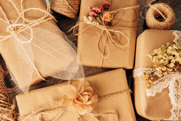 Present boxes in florist rustic romantic style in ecological floristic wrapping.