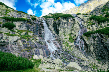 Fototapeta Panoramic view of Skok waterfall and the lake in the western part of High Tatras, Slovakia obraz