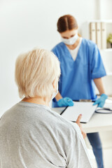 elderly woman and doctor examination medical masks