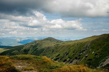 Incredibly beautiful panoramic views of the Carpathian Mountains. Peaks in the Carpathians on a background of blue sky