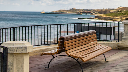 Fototapeta na wymiar bench by the sea