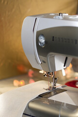 Part of a household sewing machine. Sewing and finishing of the product with decorative stitching. Focus point on the Presser foot