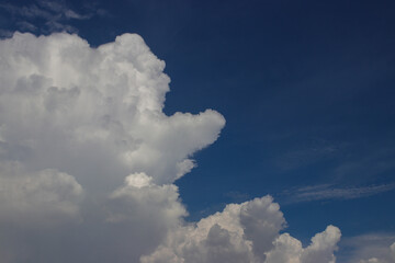 Cumulus clouds with a clear blue sky background in the midday. Types of clouds stock images.