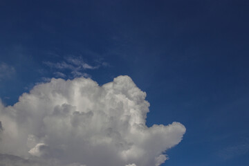 Cumulus clouds with a clear blue sky background in the midday. Types of clouds stock images.