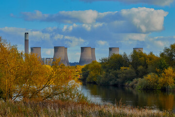 English landscape image with a river and power station.