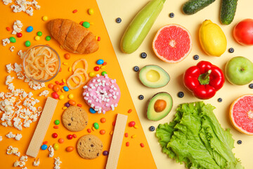 healthy foods and unhealthy foods on a colored background close-up top view.