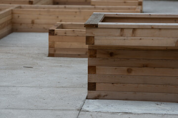 wooden garden boxes under construction in the park