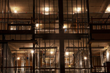 construction site illuminated at night metal structure and concrete development in progress