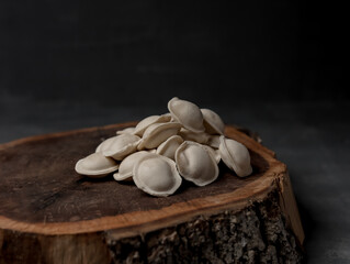 dumplings on a wooden stand on a gray background