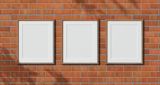 Three wooden frames on the red bricks wall. 3D render wooden frame mock up. Empty interior. 3D illustrations. 3D design interior. Template for business. Passe partout frame. Shadow. Triptych.