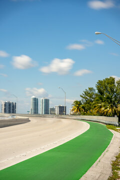 Vertical photo of a green painted bike lane Key Biscayne Miami FL