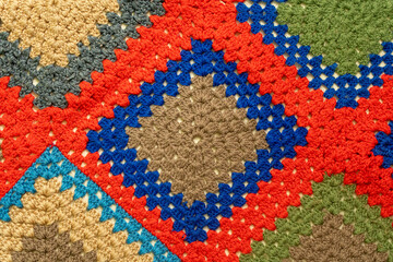 Crocheted colored wool blanket with squares