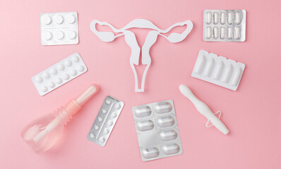 Concept top view banner of Gynecology, woman health. Vaginal suppositories, tablets on pink...