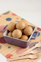 Tahu Bulat (Round Tofu), Indonesian Favorite Dish, Deep Fried and Seasoned with Seasoning Powder. Copy Space on Wood Background
