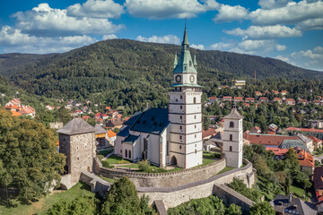 Fototapeta na wymiar Aerial view of Kremnica, well-preserved medieval town built above important gold mines is the site of the oldest still-working mint in the world, fortified gothic Church of St. Catherine, city walls