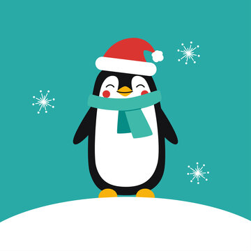 A baby penguin in a festive red hat and scarf stands on a snowy edge