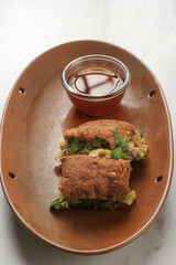 Martabak Telur is Popular Street Food in Indonesia. Egg, Spring Onion Wrapped with Thin Flour Batter