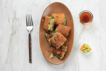 Martabak Telur is Popular Street Food in Indonesia. Egg, Spring Onion Wrapped with Thin Flour Batter