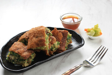 Martabak Telur is Popular Street Food in Indonesia. Egg, Spring Onion Wrapped with Thin Flour Batter