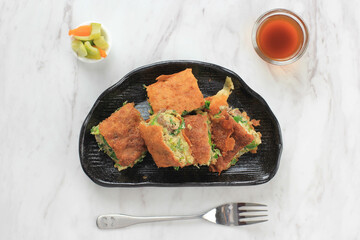 Martabak Telur is Popular Street Food in Indonesia. Egg, Spring Onion Wrapped with Thin Flour Batter