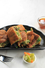 Martabak Telur is Popular Street Food in Indonesia. Egg, Spring Onion Wrapped with Thin Flour Batter