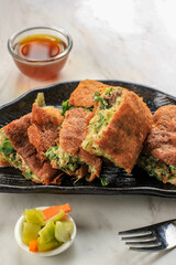 Martabak Telur is Popular Street Food in Indonesia. Egg, Spring Onion Wrapped with Thin Flour Batter