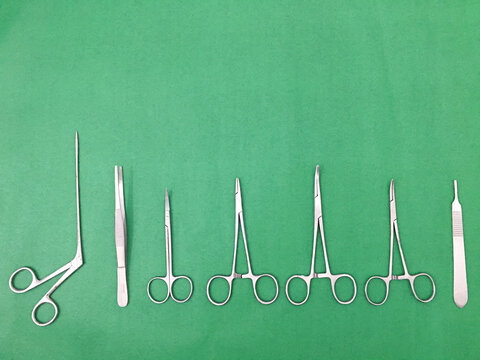 Surgical equipment of the surgeon laying on the green cloth prepare for medical surgery