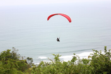 picture of a kite hanging from the sand dunes on the beach of the famous city of Yogyakarta in Indonesia
