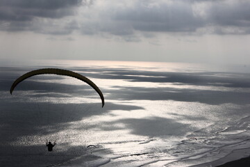 picture of a kite hanging from the sand dunes on the beach of the famous city of Yogyakarta in Indonesia