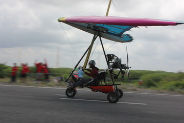 picture of a kite hanging from the sand dunes on the beach of the famous city of Yogyakarta in Indonesia