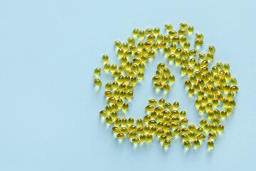 Obraz premium Letter A made of capsules on color background