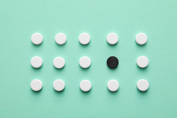 Pills on color background. Concept of uniqueness