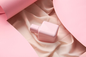 Composition with bottle of aromatic perfume on color background, closeup