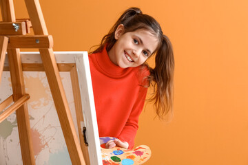 Cute little painter on color background