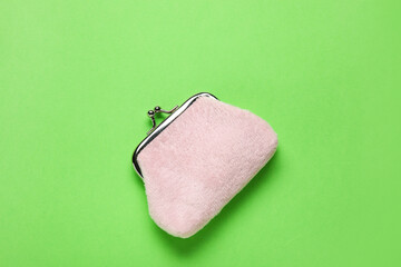 Pink wallet on green background