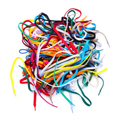 Heap of different shoe laces on white background