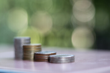 Growing Money, business finance and saving money investment , Money coin stack growing graph, plant growing up on coins. Balance savings and investment. growing growth year 2020 to 2022 concept.