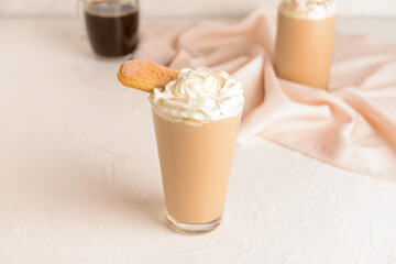 Glass of tasty Tiramisu Latte on white background