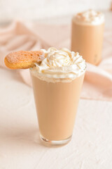 Glass of tasty Tiramisu Latte on white background