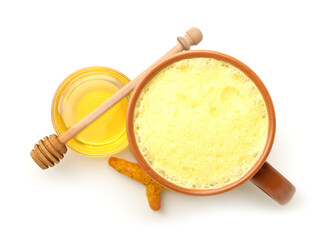 Cup of tasty turmeric latte with honey on white background