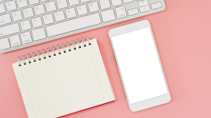 Empty notebook for to do list with computer keyboard and smartphone white screen on pink background, Workspace for text, top view.