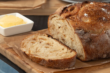 Proving delicious baked bread with butter.