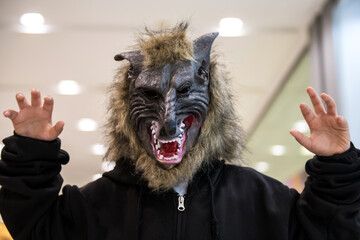 Scary kid with creepy horrible werewolf mask