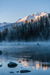 The winter landscape of Kanas lake in Xinjiang province, China, at sunrise. - obrazy, fototapety, plakaty